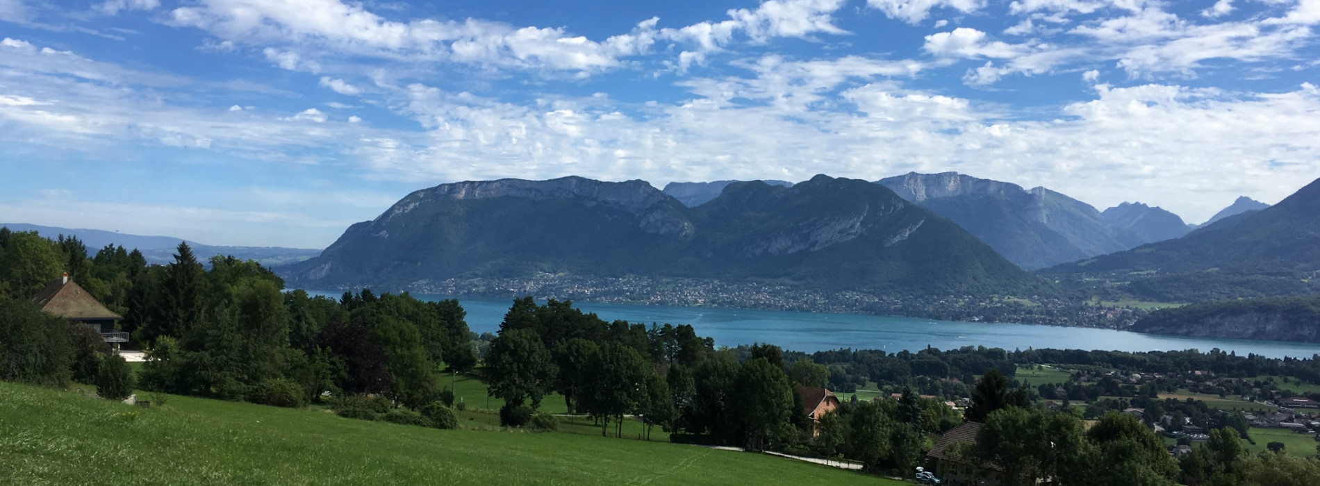 mountains, lakes and lush green pastures