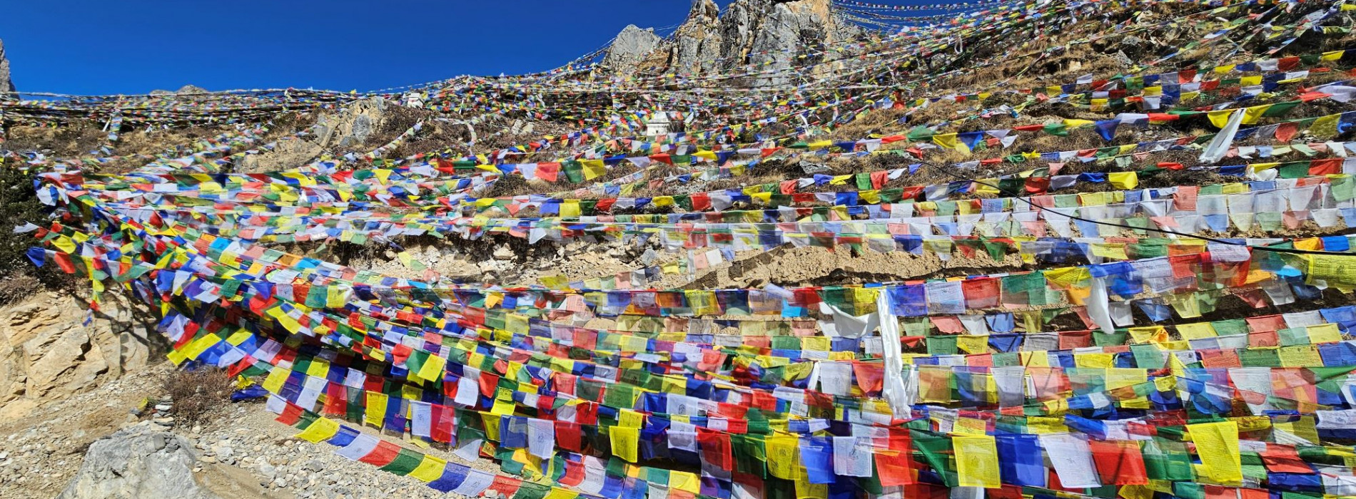 Prayer flags swathing path on descent