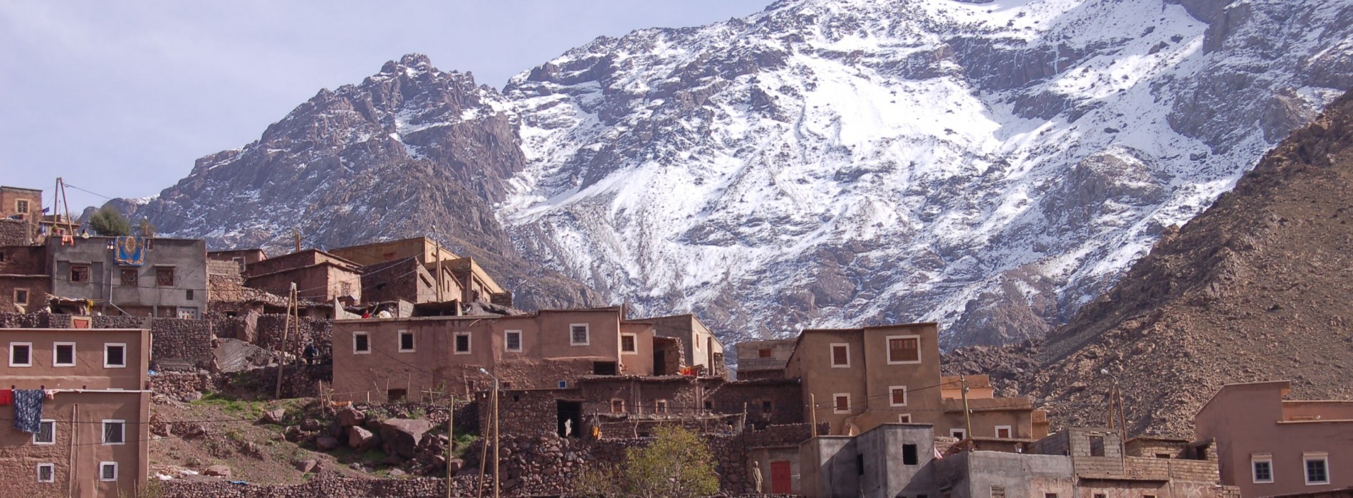 Village with snow topped mountains