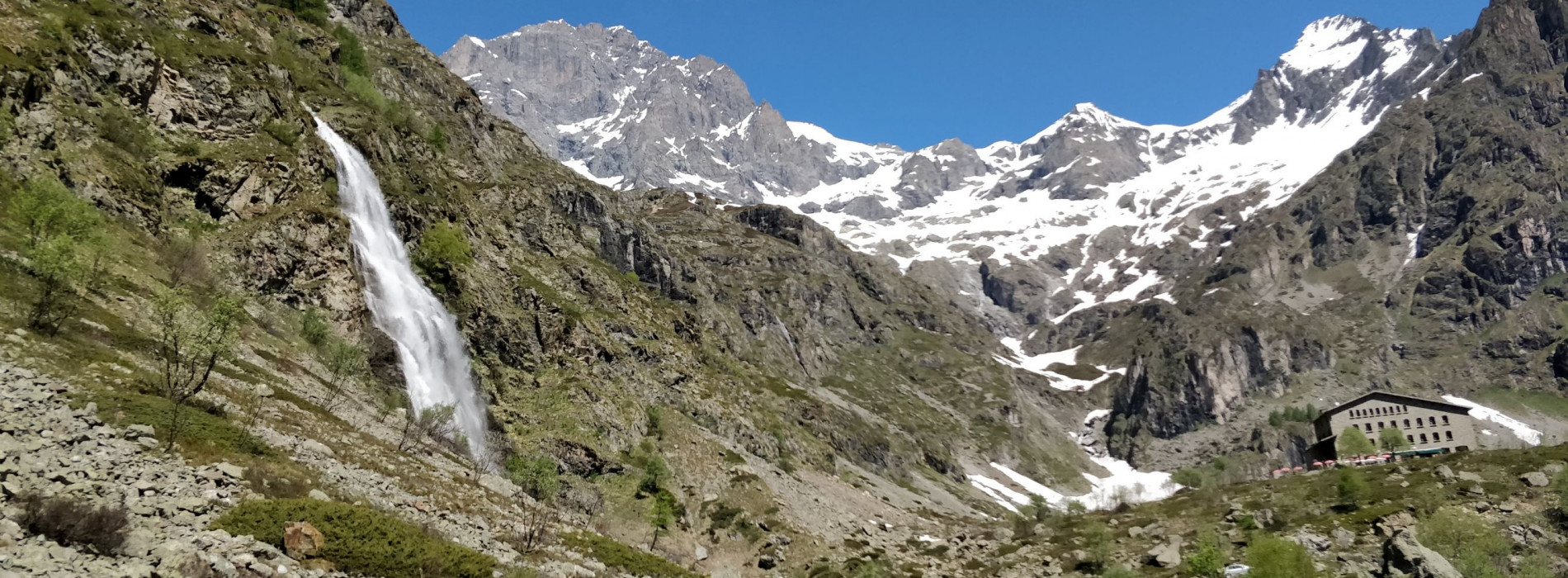 Refuge and waterfall at trek start-point